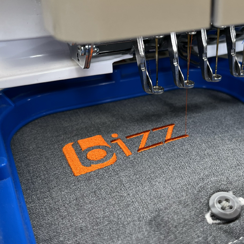 Embroidery machine stitching logo